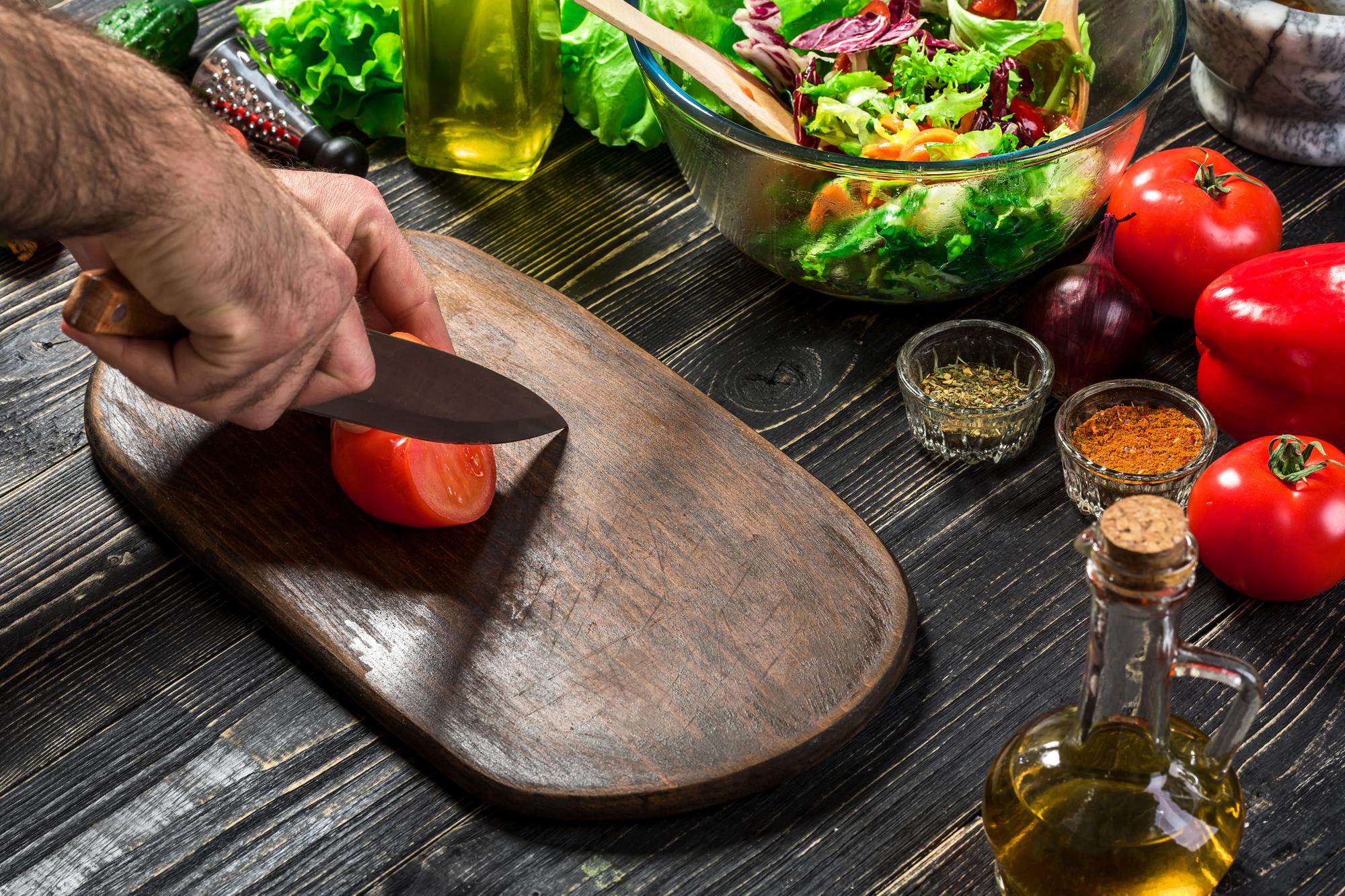 Workshop chef preparing ingredients on wooden table