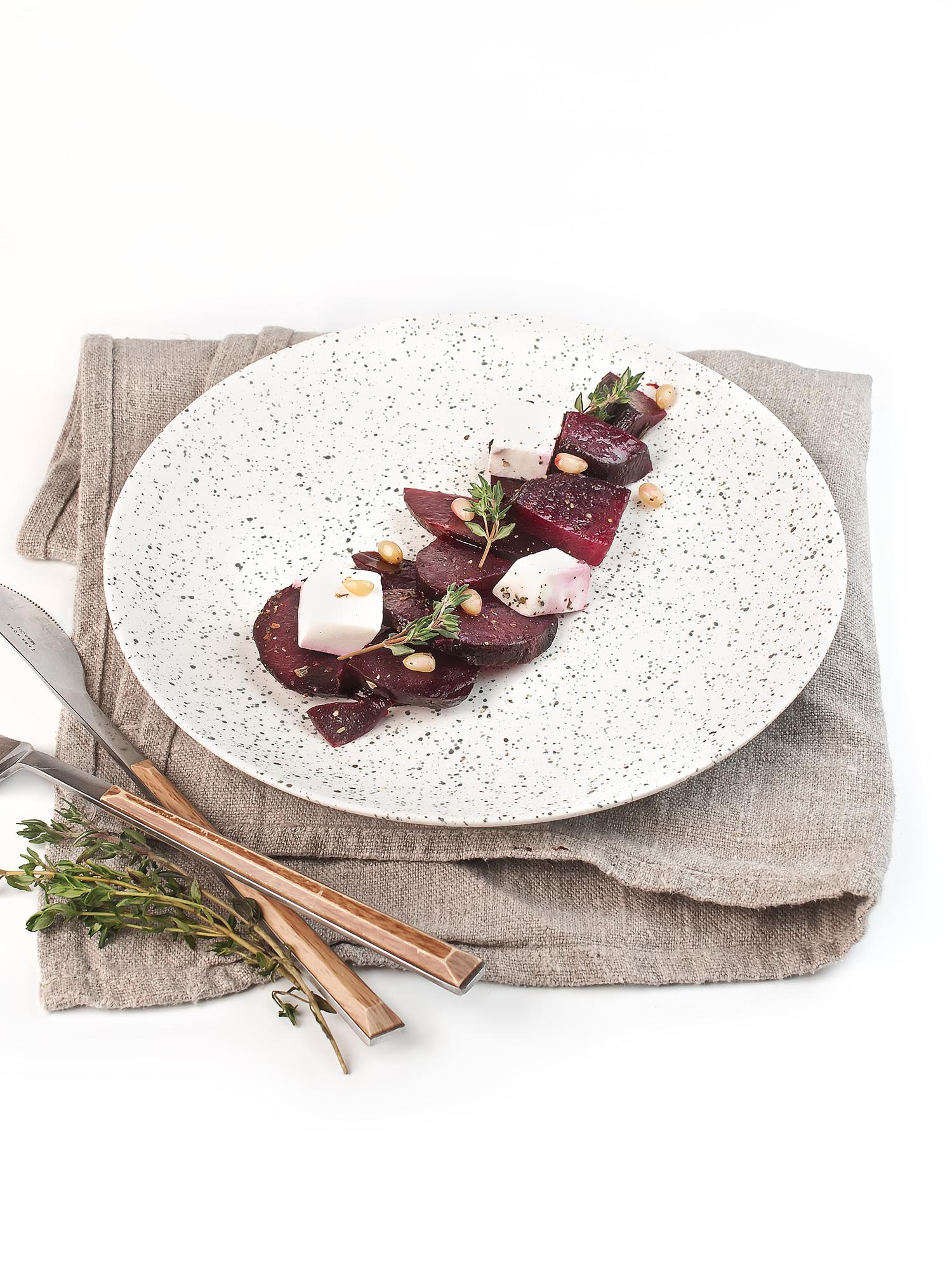 Large plated tasting menu on marble table